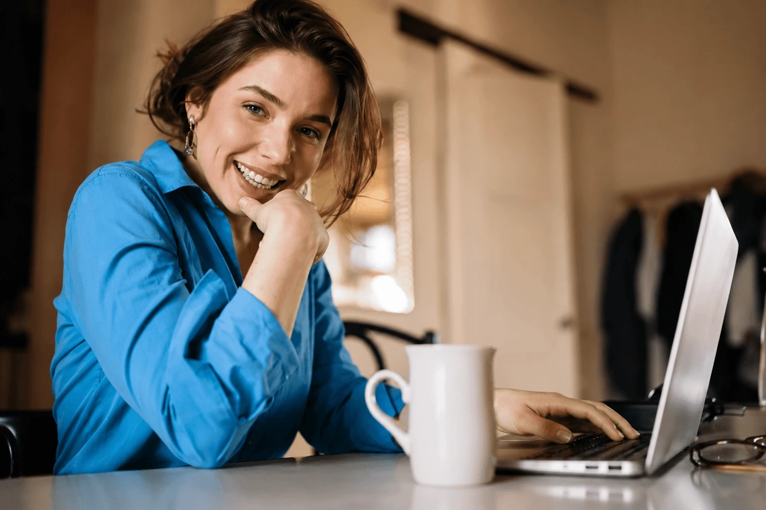 Business professional working on a laptop while managing financial partnerships and payment workflows.