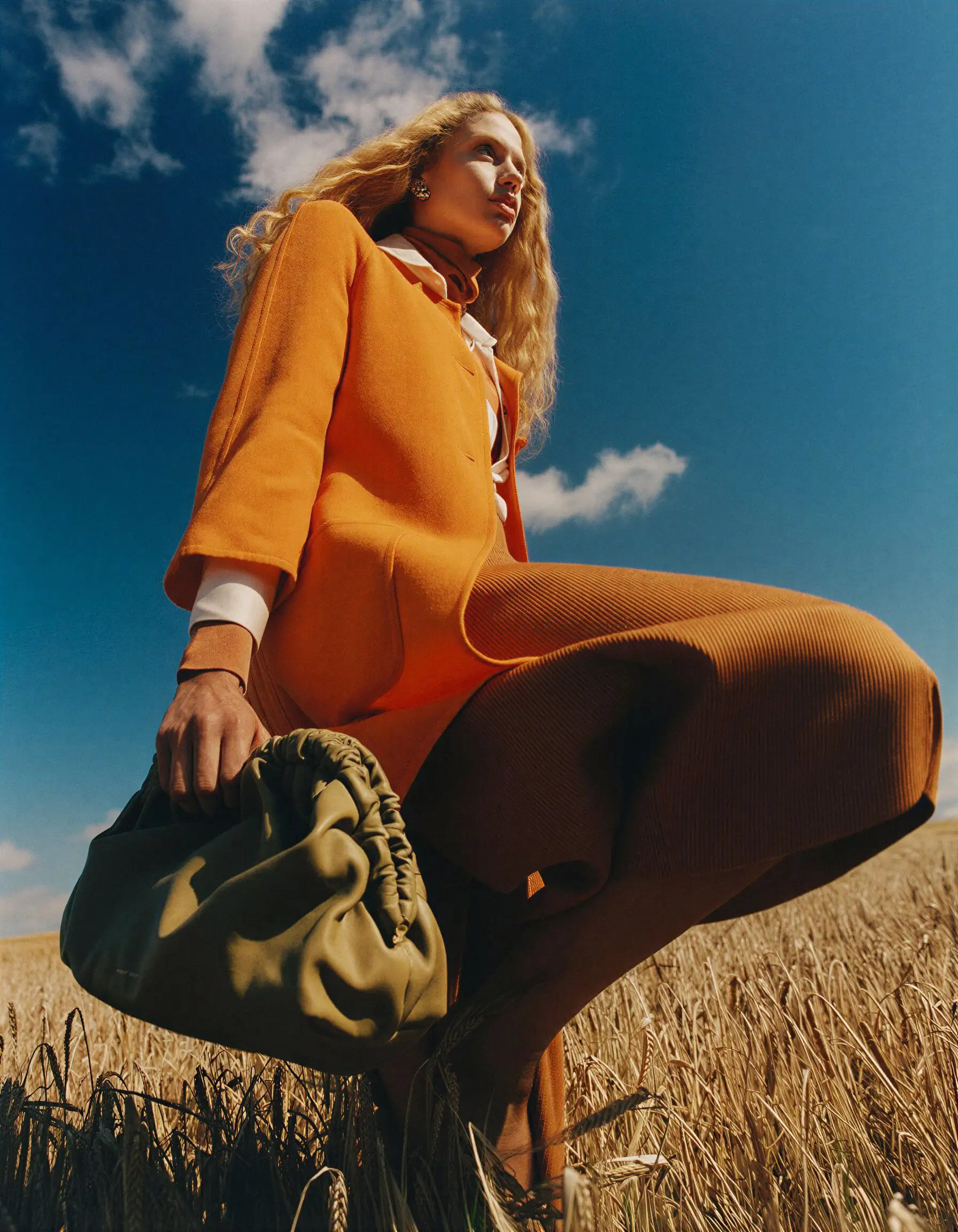 Sunlit mountain peak against dramatic clouds