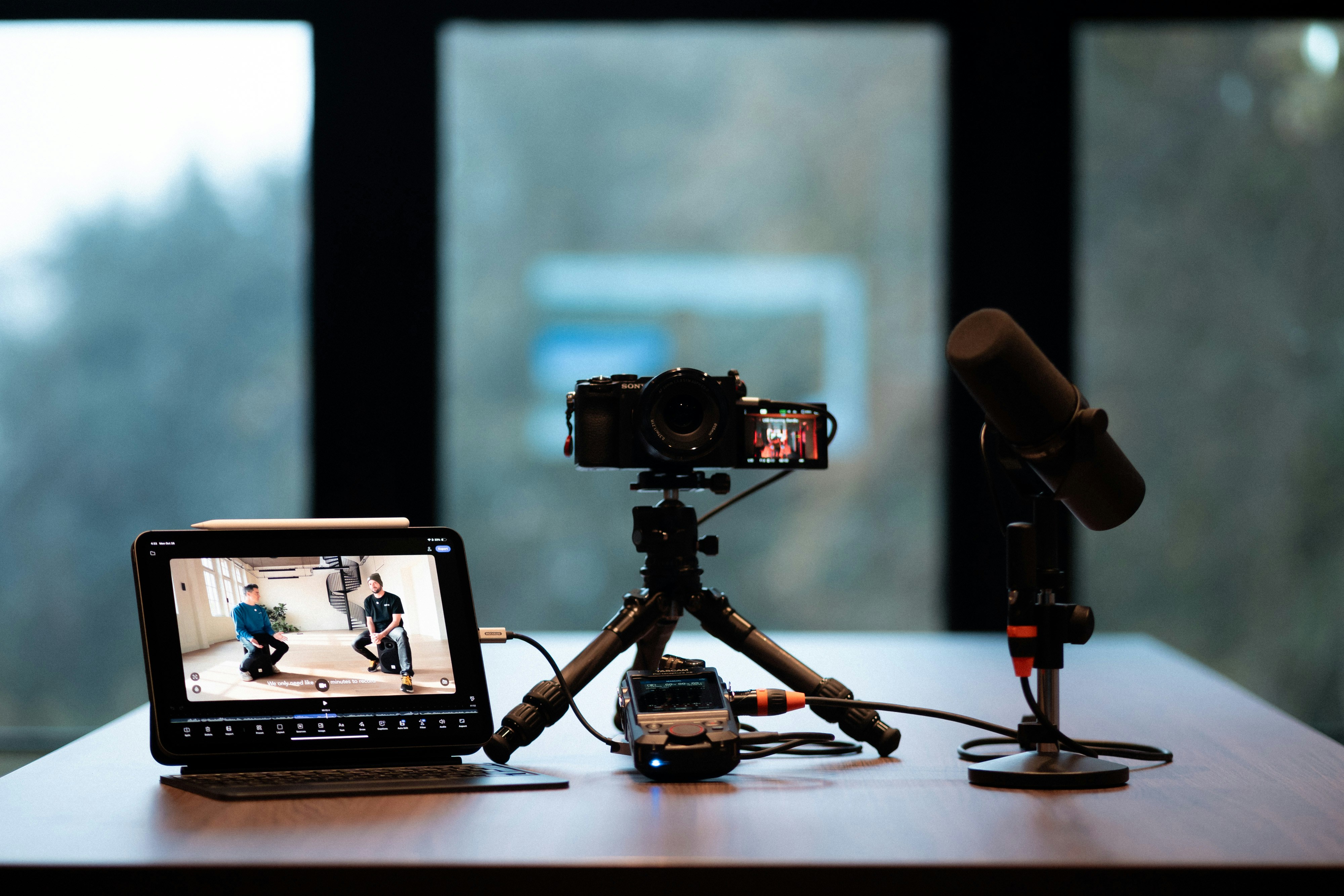 Camera, monitor, and microphone setup for recording.
