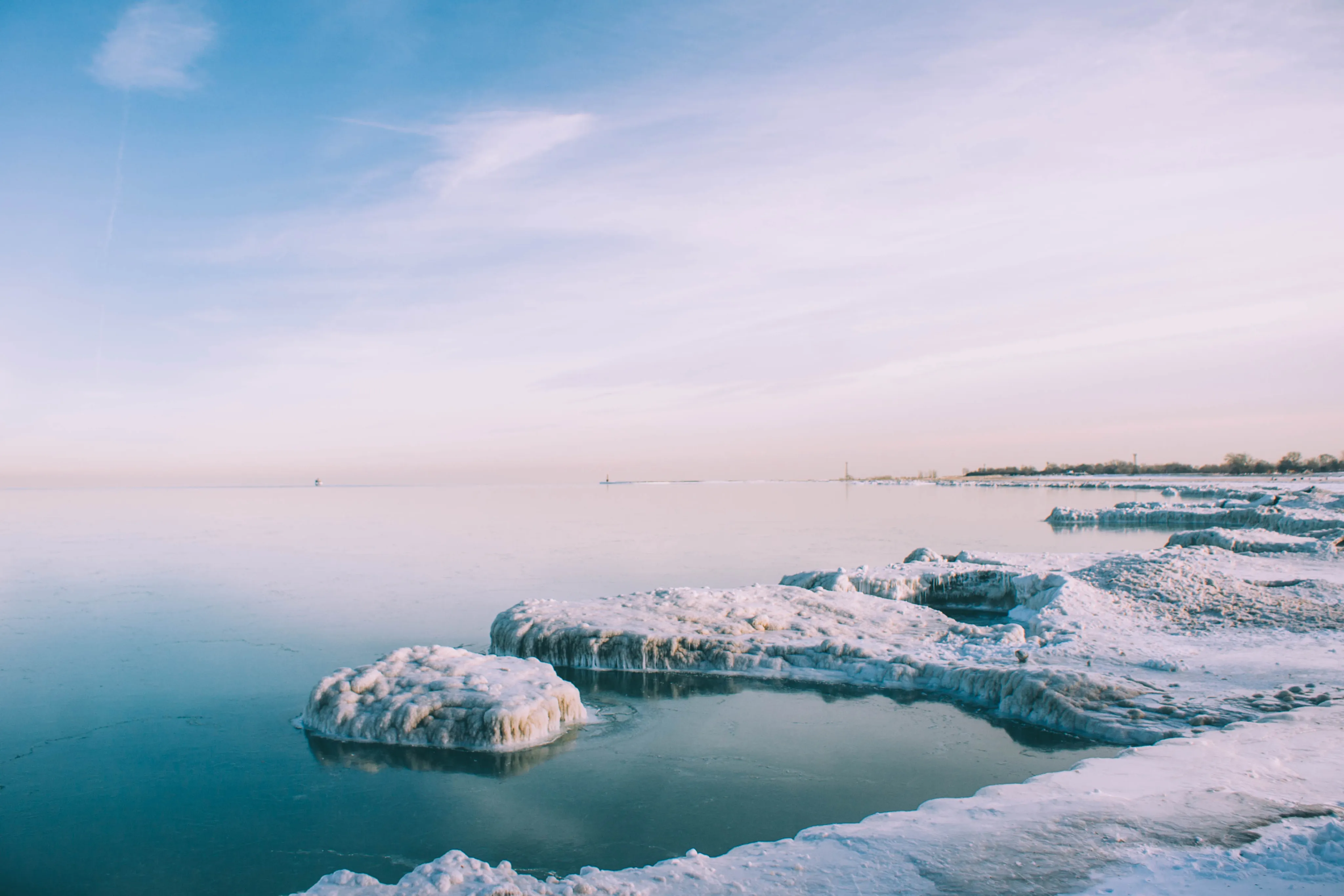 Frozen ice formations along a winter shoreline