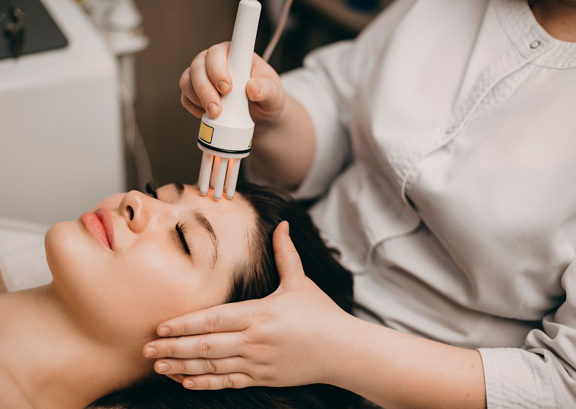 Woman receiving cosmetic skin treatment