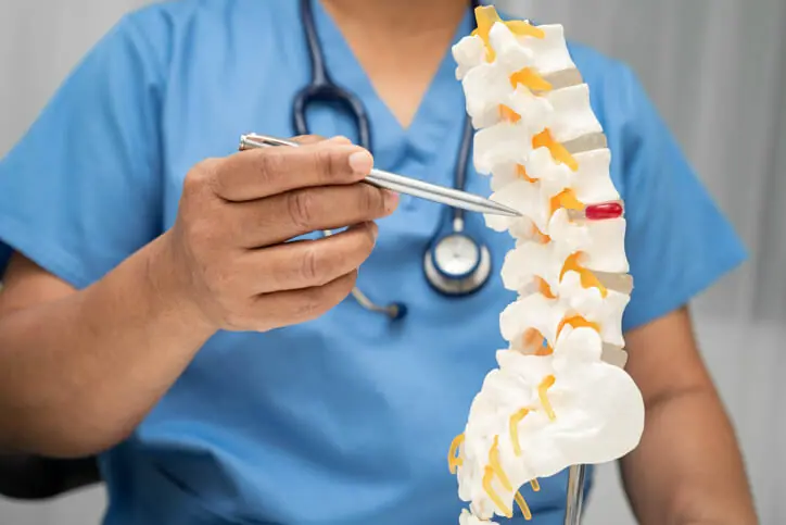 Person experiencing neck pain in an orthopedic care setting