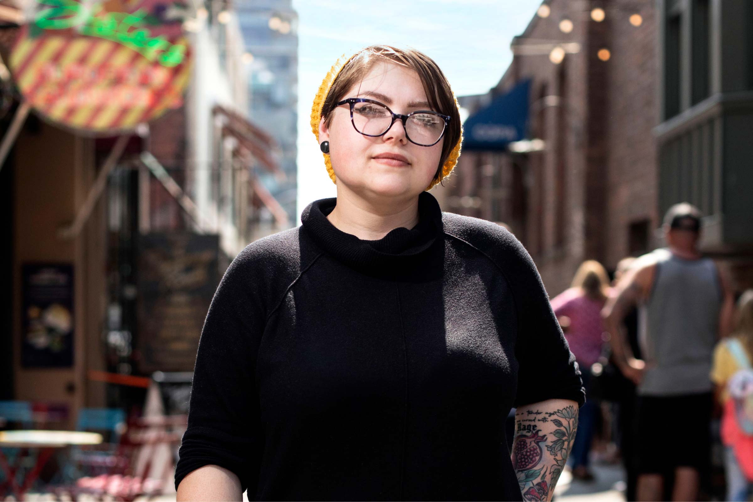 Dakkota standing in a city setting.