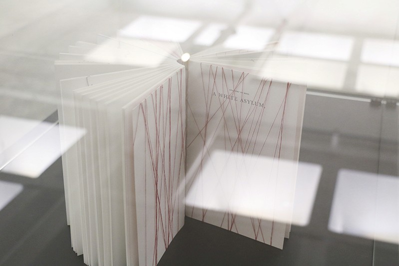 a book inside a glass box