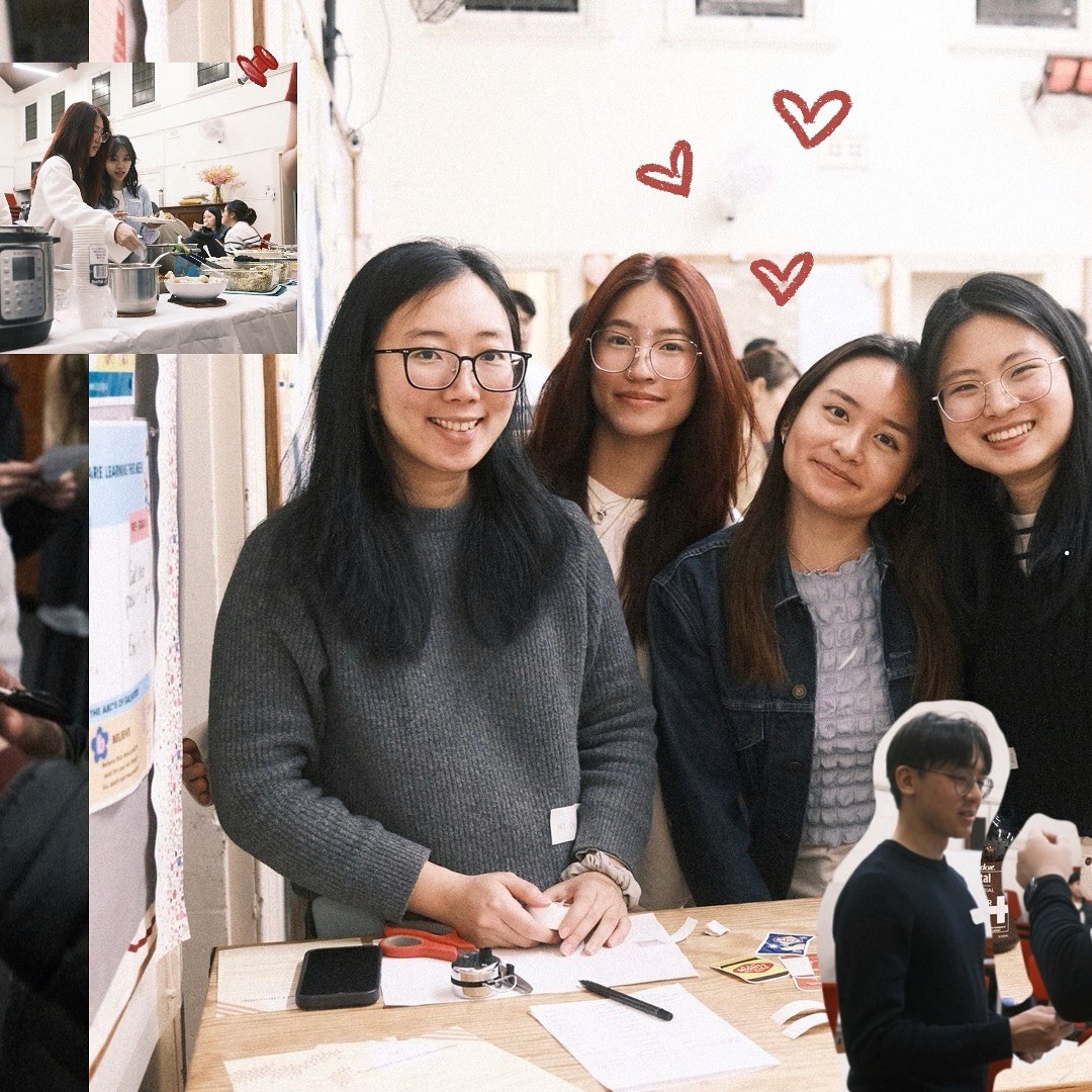 A restaurant interior featuring marble countertops, brown leather chairs, wood-paneled walls, and round pendant lights hanging above a bar set with wine glasses.