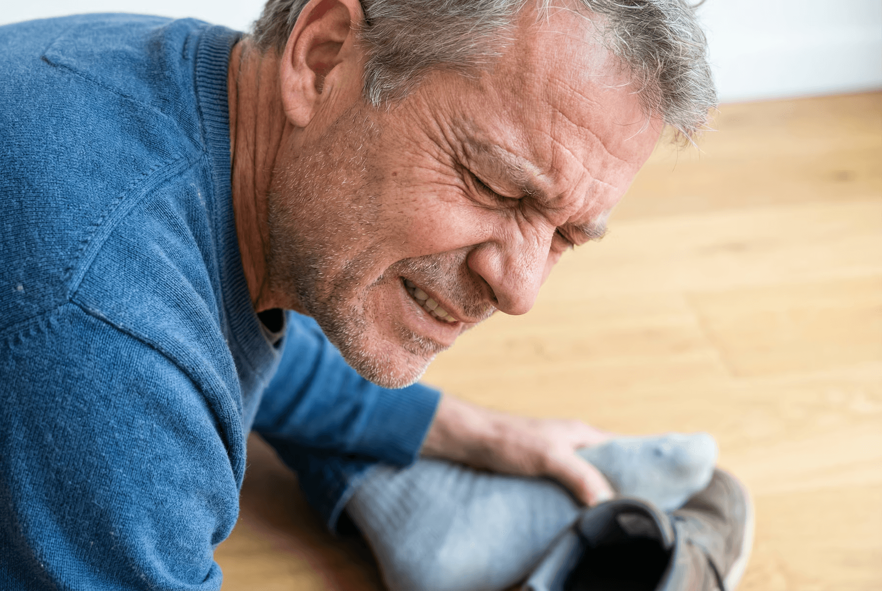 man kissing woman on check beside body of water