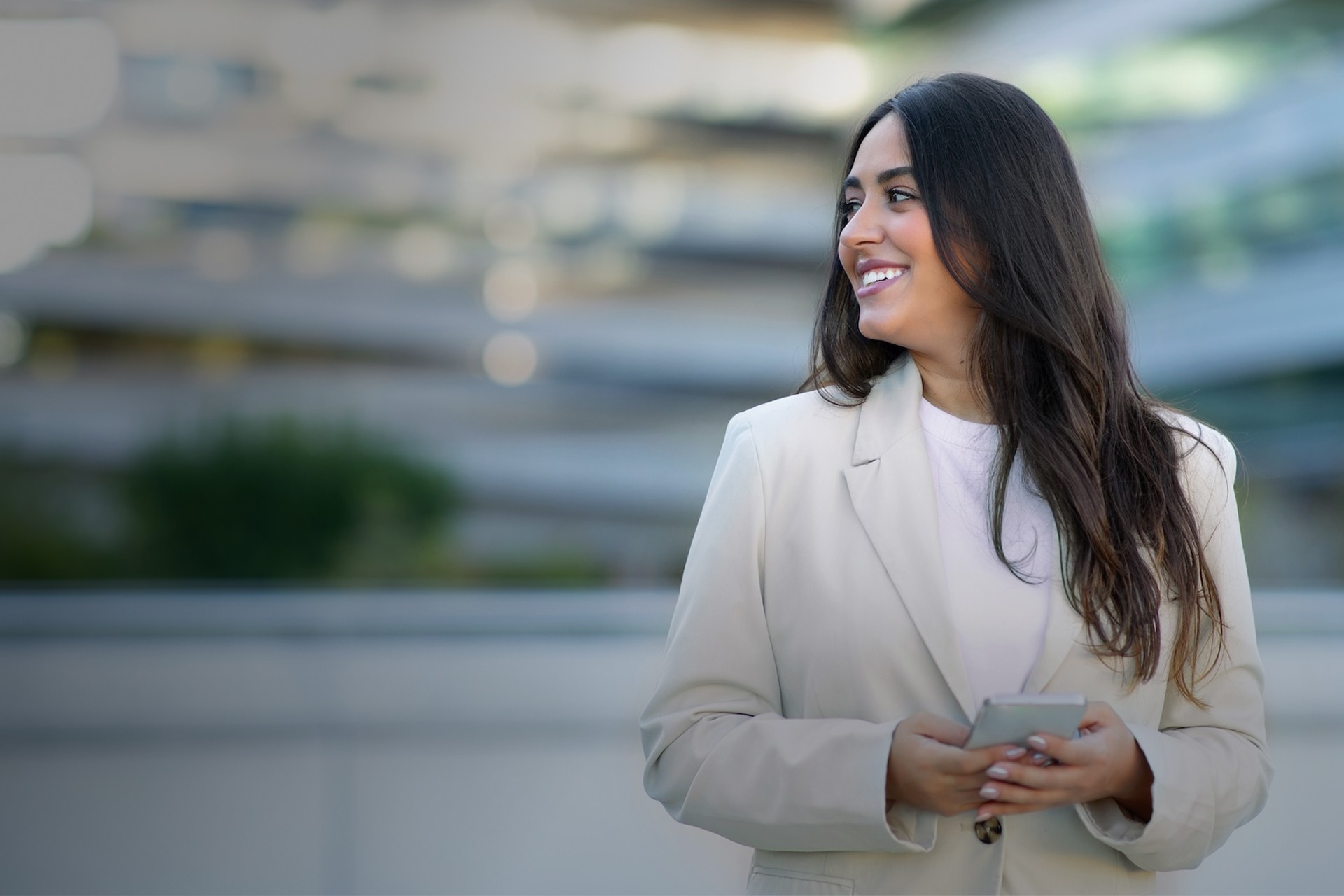 A photograph of an executive using CloudControl by signageOS to monitor and control digital signage devices