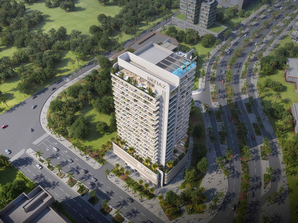 Aerial view of Le Blanc by Imtiaz, a tall building surrounded by a bustling cityscape.