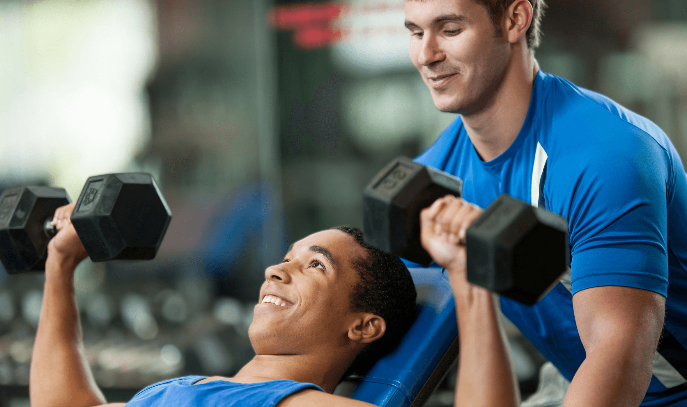 newly qualified personal trainer working with a client