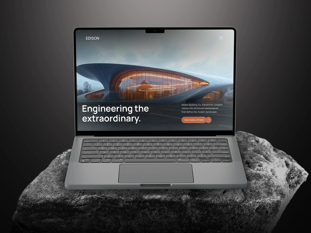 Edison — 5 ta image alt text Image 1 — Hero / Card (MacBook on rock, hero screen)  Edison Framer template — premium architecture website design on MacBook, engineering the extraordinary landing page for $50M+ structural firms 2026