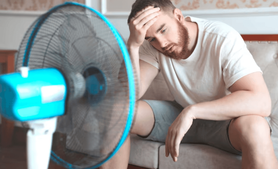 Men uncomfortable indoors needing AC repair Dallas