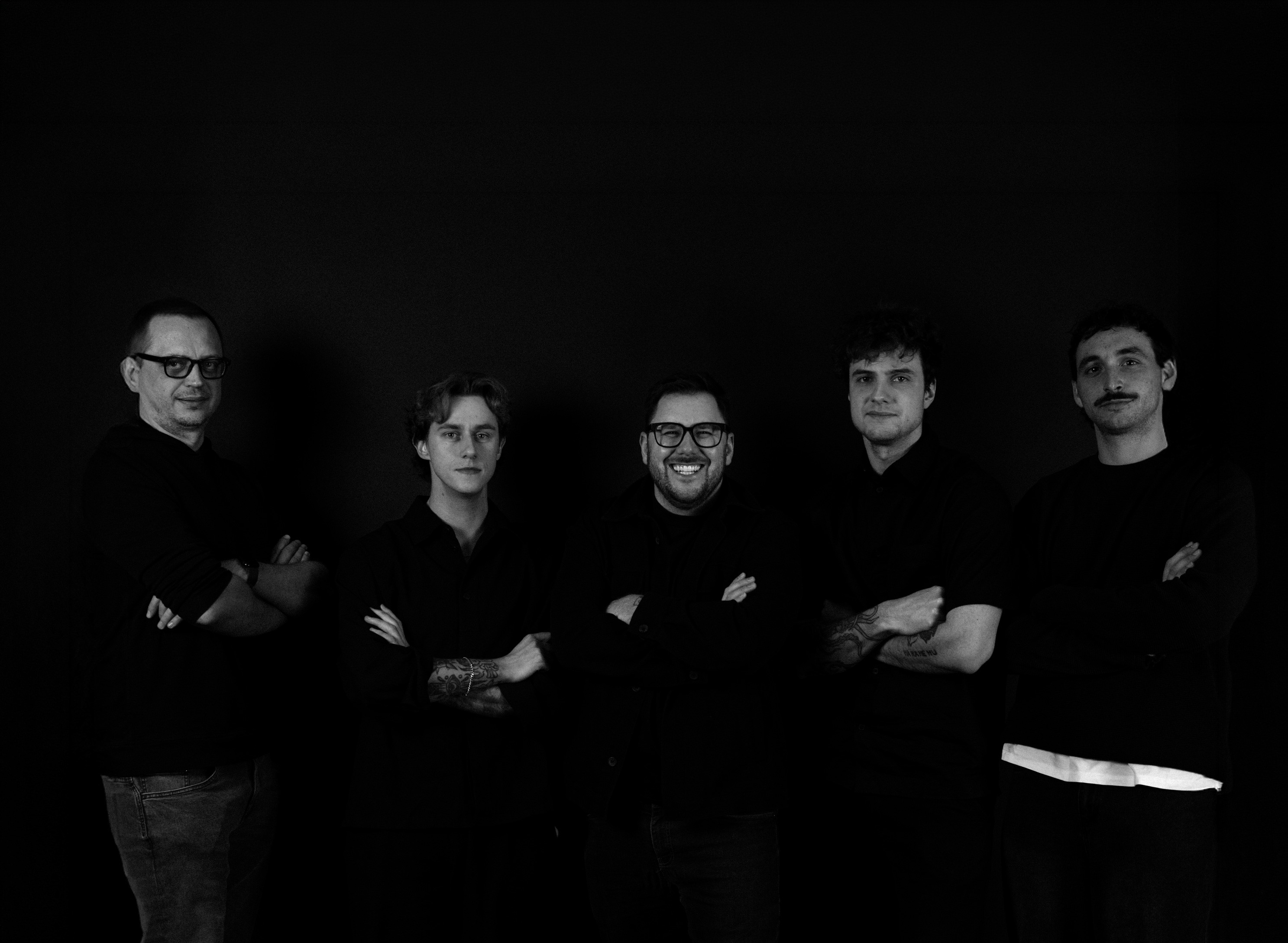 People celebrating, red stickers floating in the air