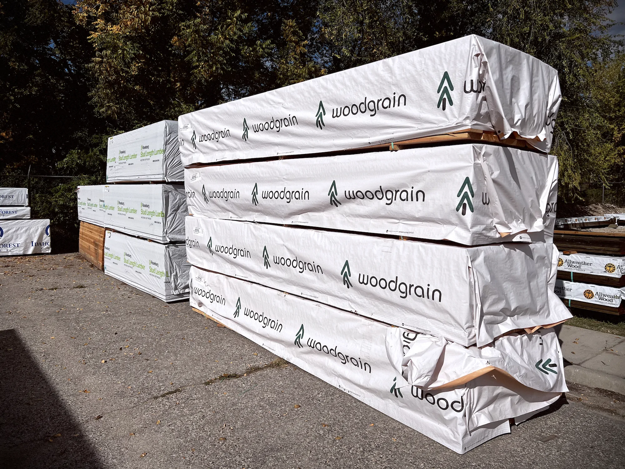 Interior of a warm, modern café rendered in line-art style with high ceilings, pendant lighting, and wood and metal furnishings.
