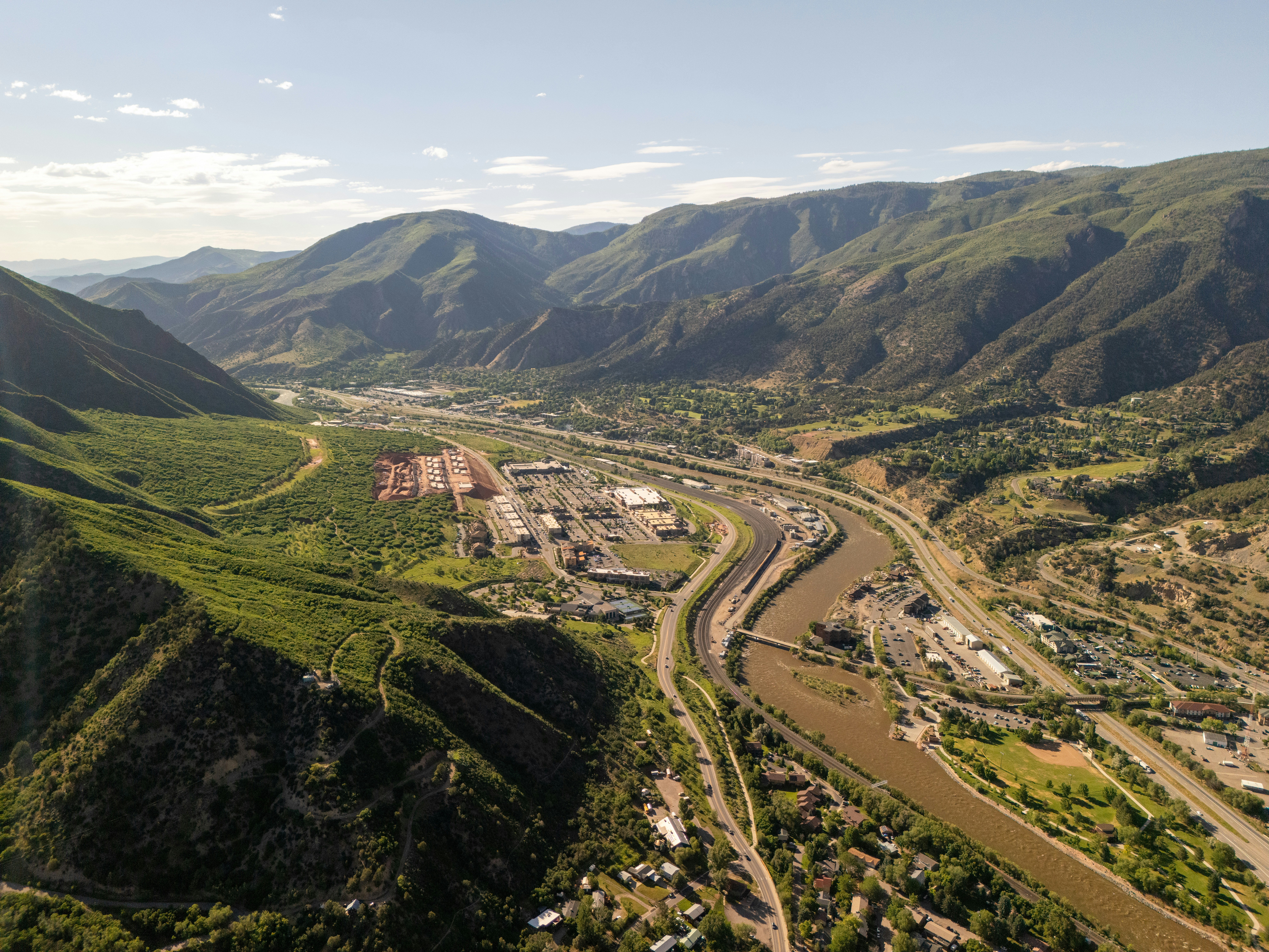 An aerial view of a valley with a river running through it