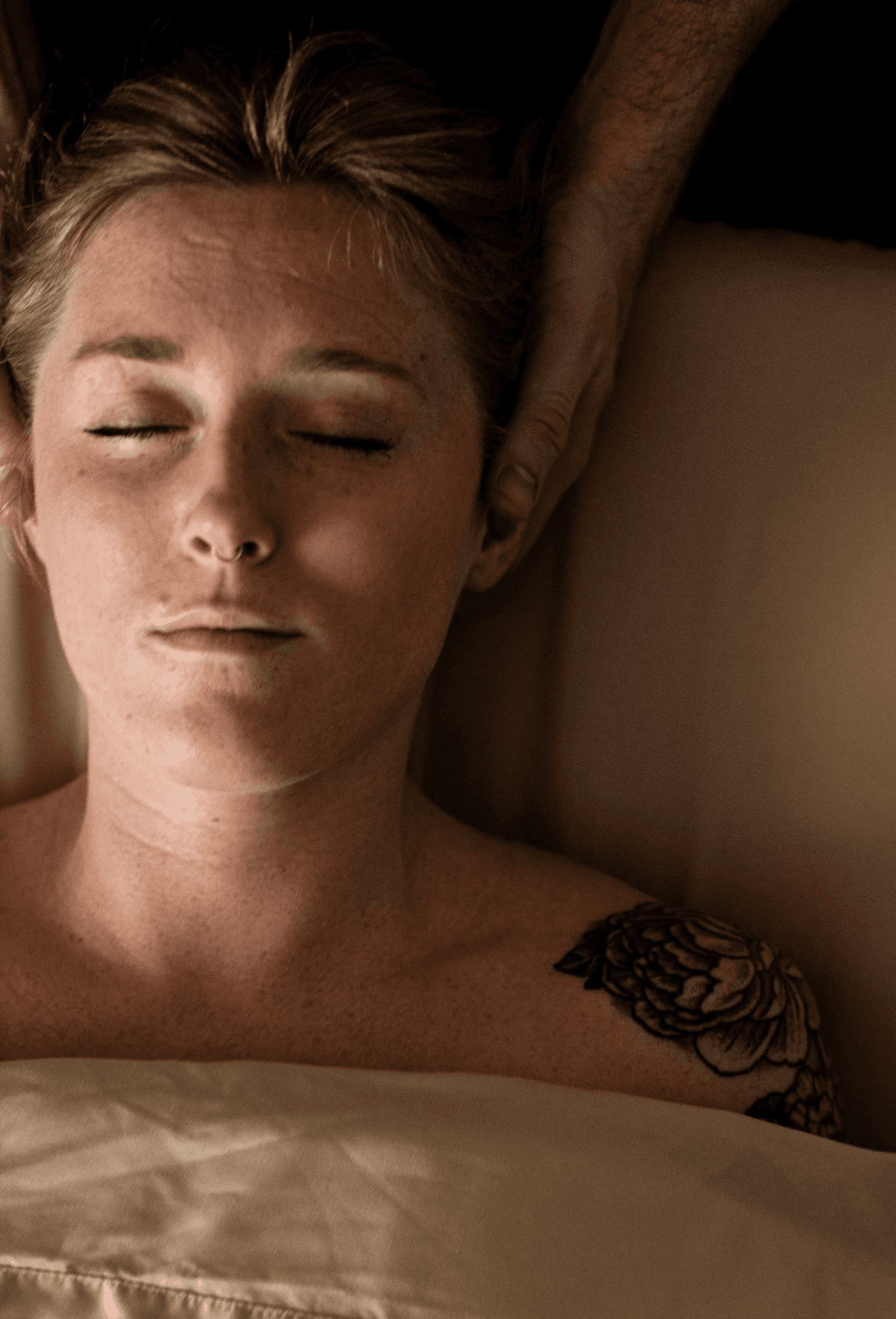 Person recieving massage therapies on spine