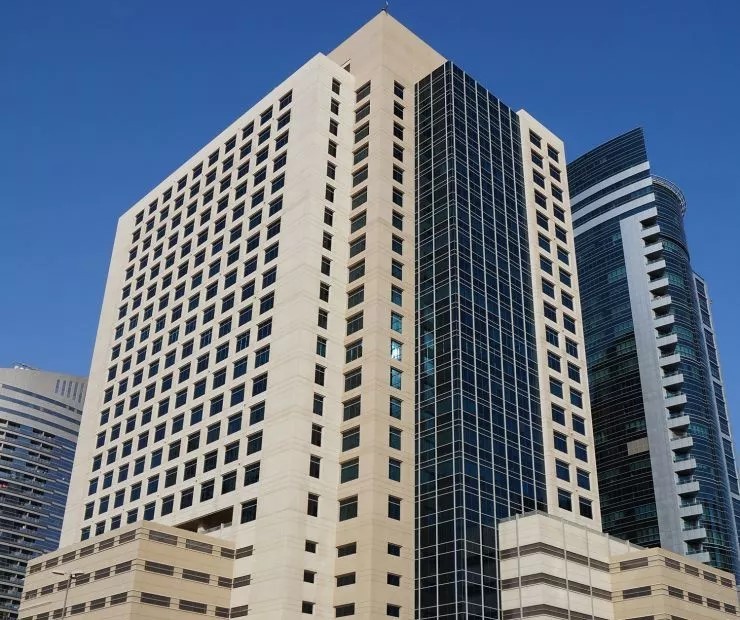 Wide view of Grosvenor Business Tower near Tecom, highlighting high-occupancy commercial investment opportunities.