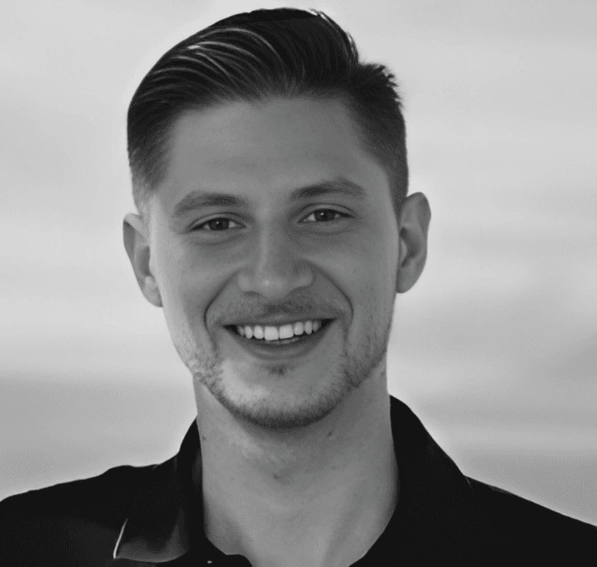 grayscale photo of people walking towards building
