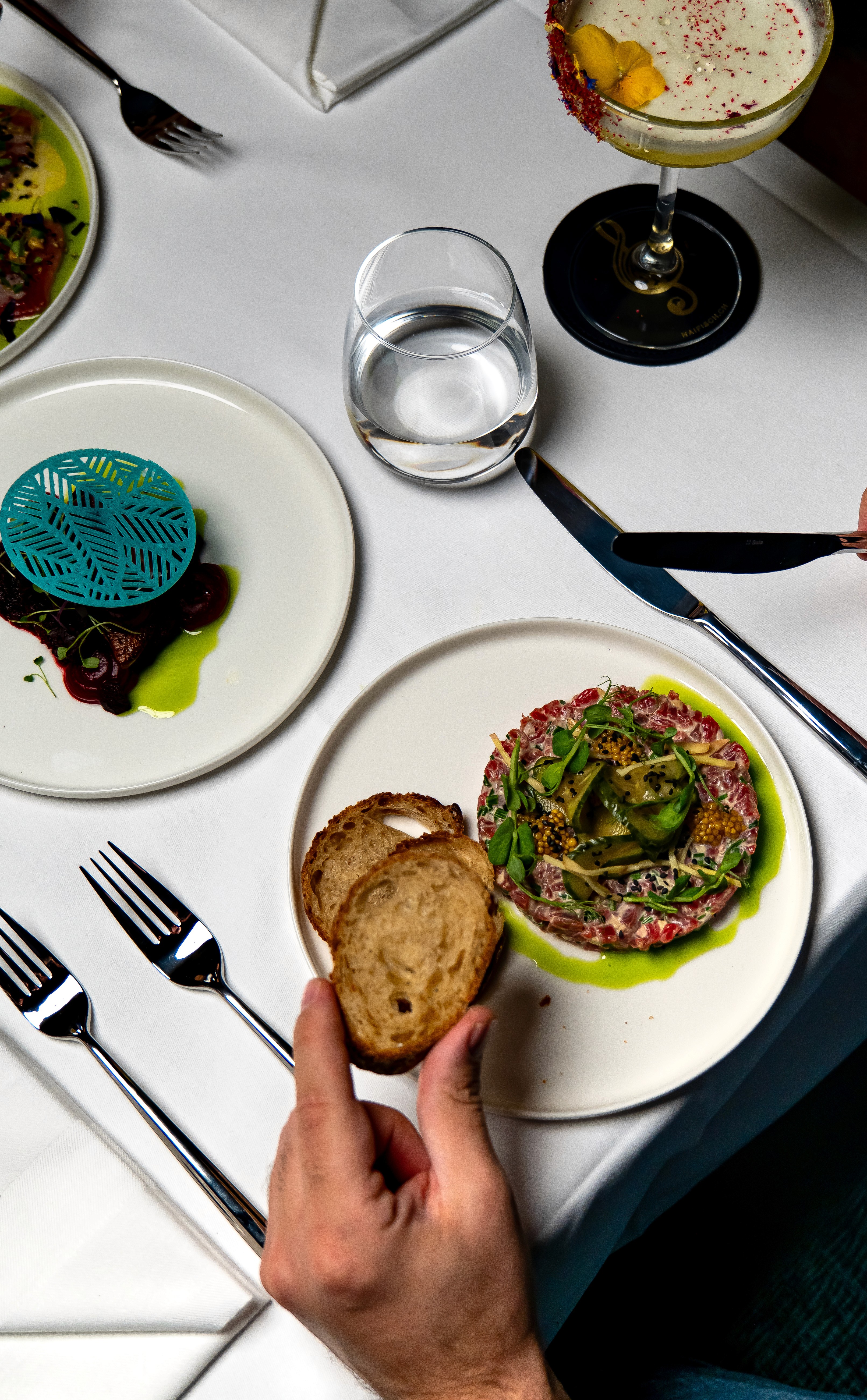 two people looking at a tablet and smiling