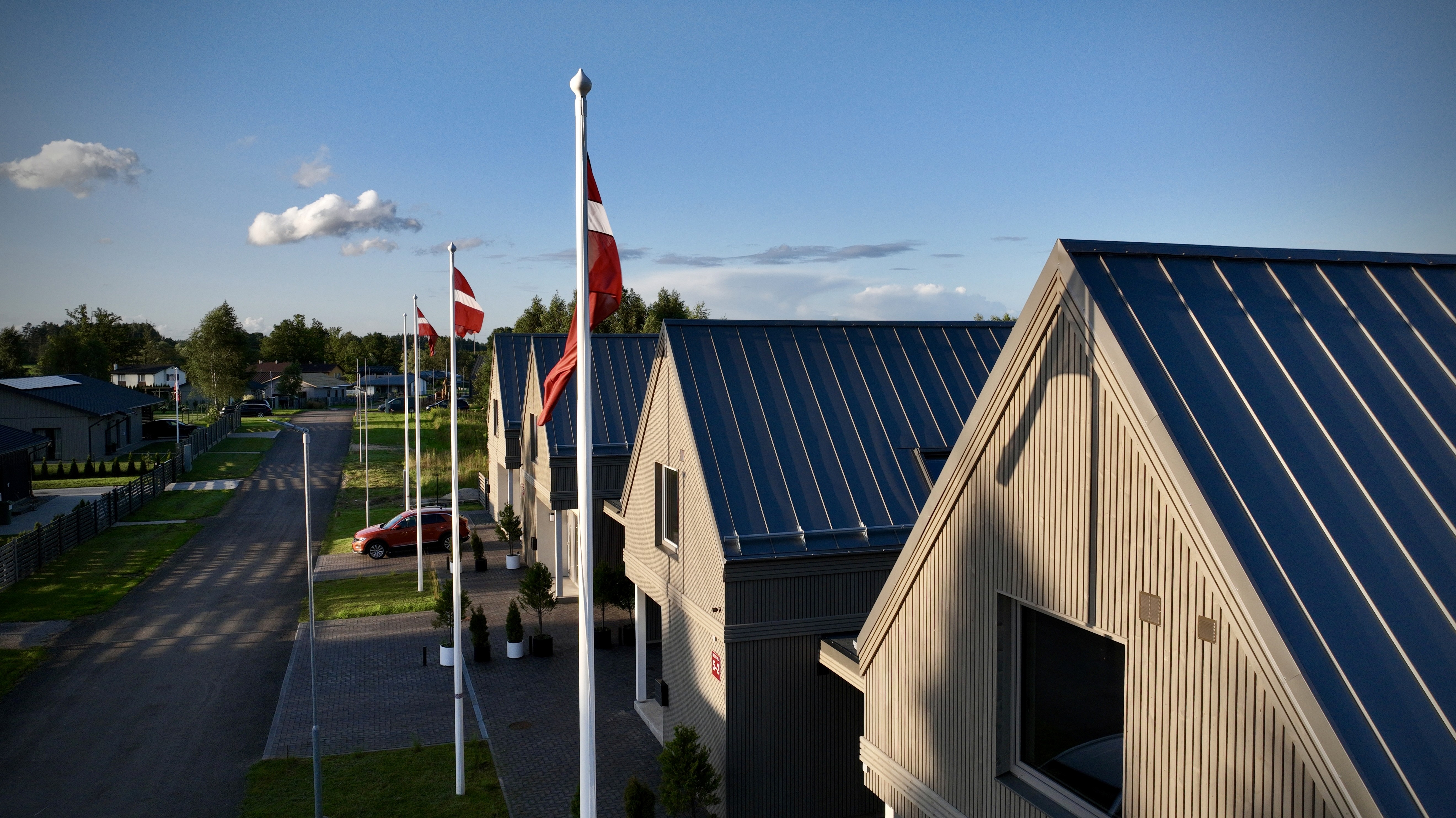 Exterior view of modern rental homes at Priežavoti Village near Riga, developed by Grande Build — tokenized on the blockchain for investor transparency.