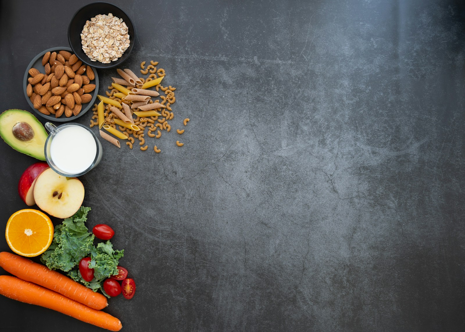 An abundant spread of fresh fruits and vegetables laid out on a wooden table, reflecting a personalized, fiber-focused eating plan