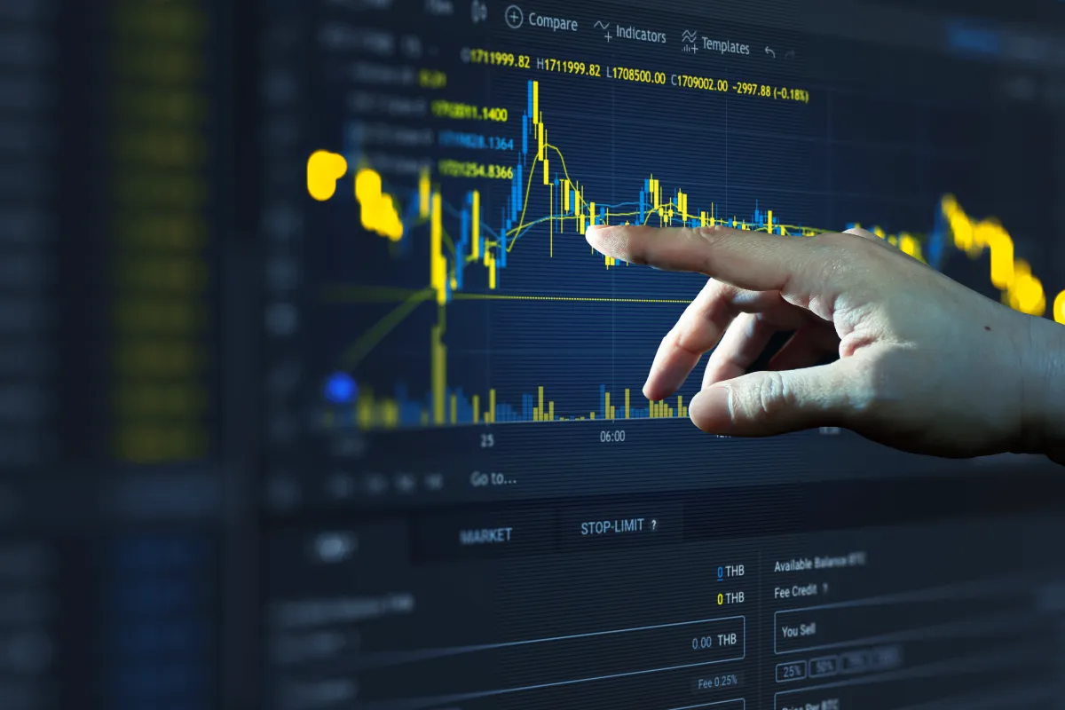 man clicking on trades - Best Prop Firm for Swing Tradin