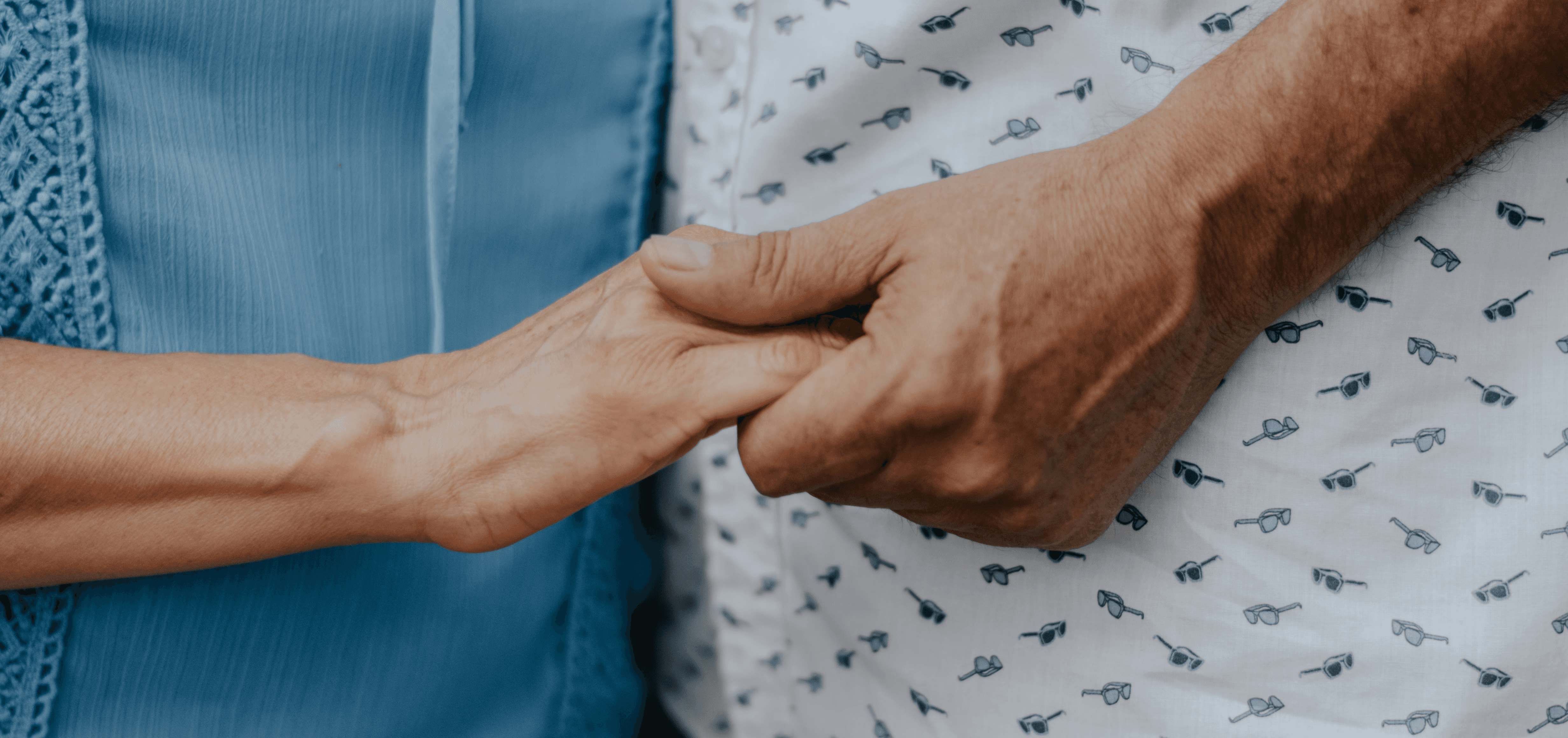 person in blue shirt and white and black pants