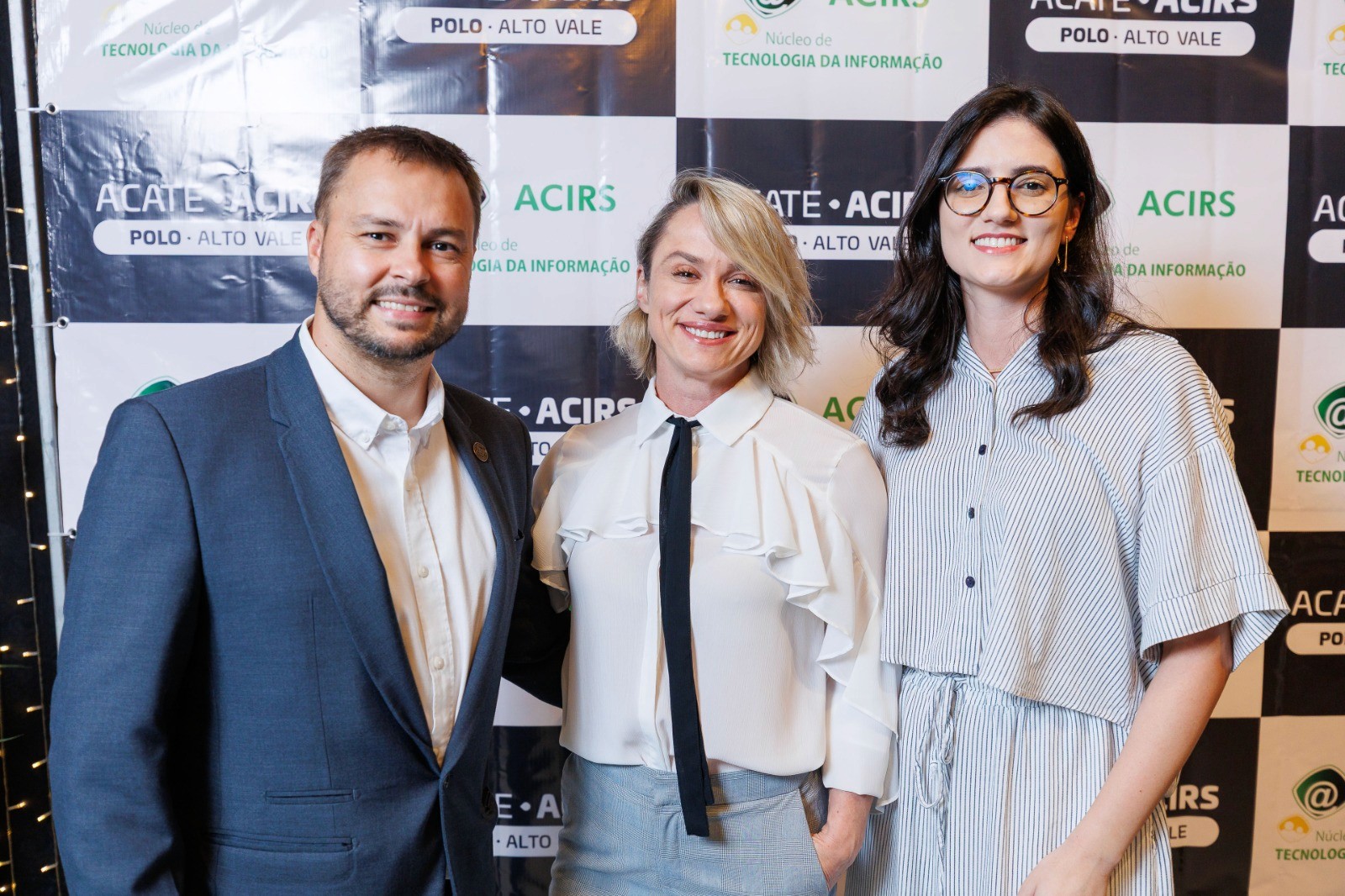 four men looking to the paper on table