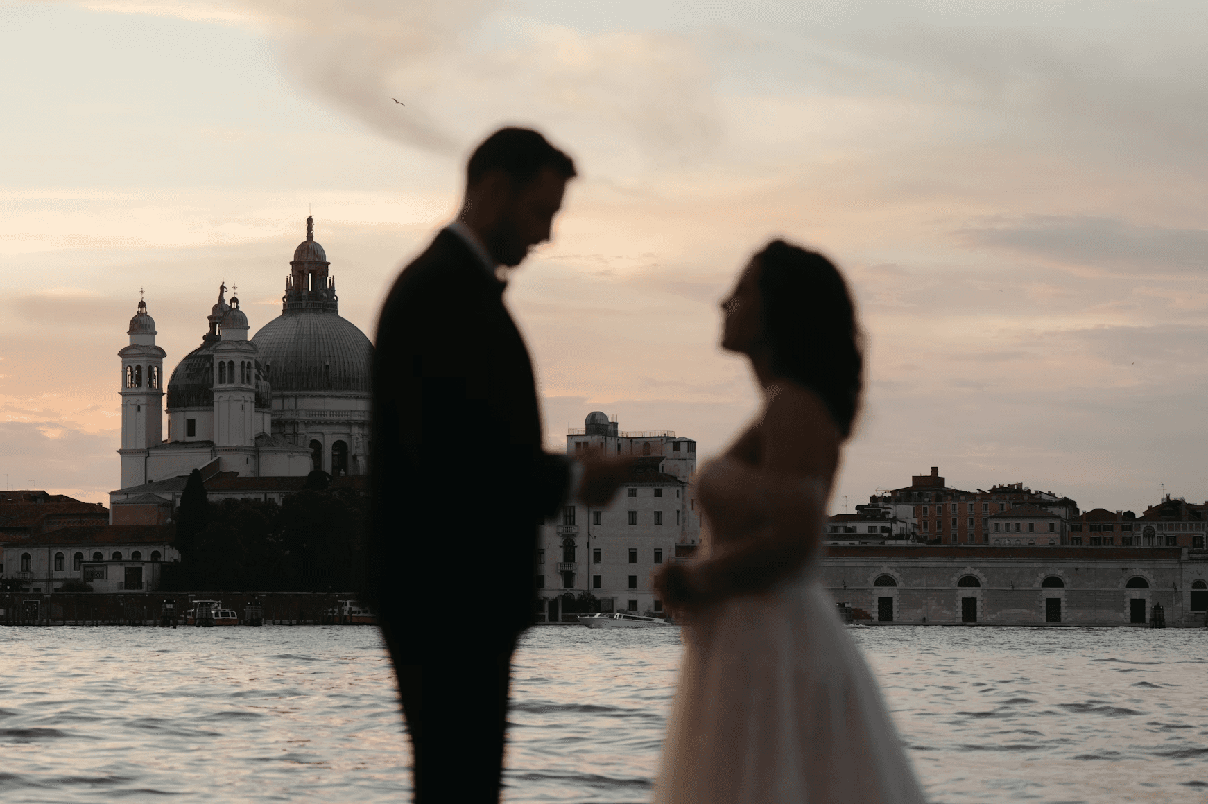 The beautiful sunset over Venice was pure romance as this couple exchanged vows during their elopement