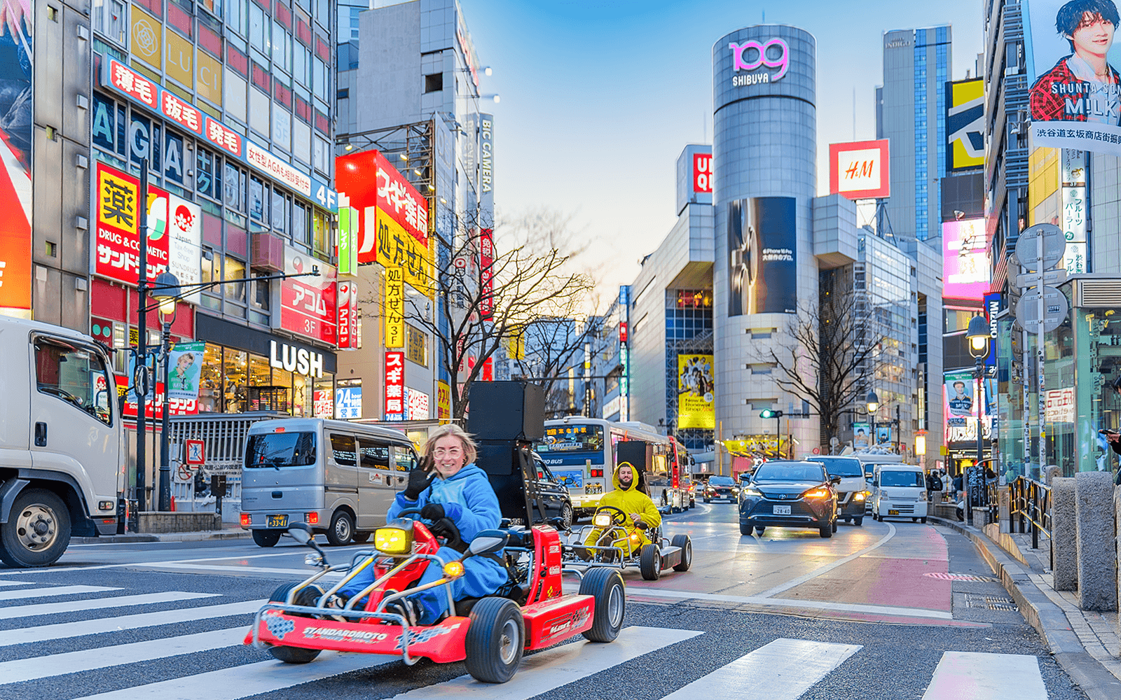 Nighttime go-kart race on illuminated track, showcasing thrilling speed and excitement in an urban setting.