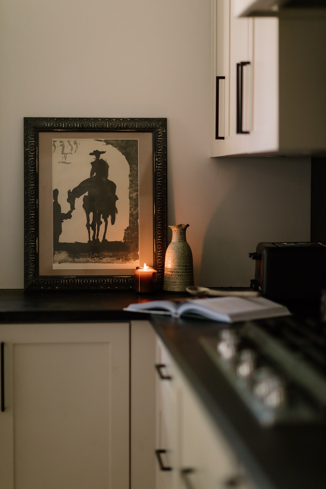 Woman in a light suit sitting thoughtfully against a terracotta wall