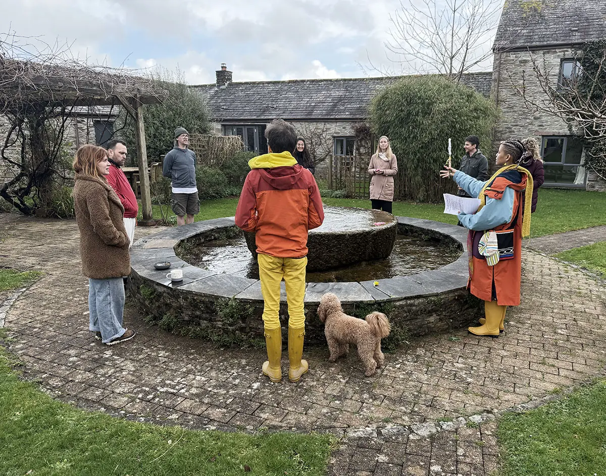 Froomies opening ceremony around the courtyard fountain with community gathered
