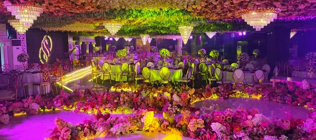 Company gathering in colorful theatrical lighting at Pandora Hall, Quezon City