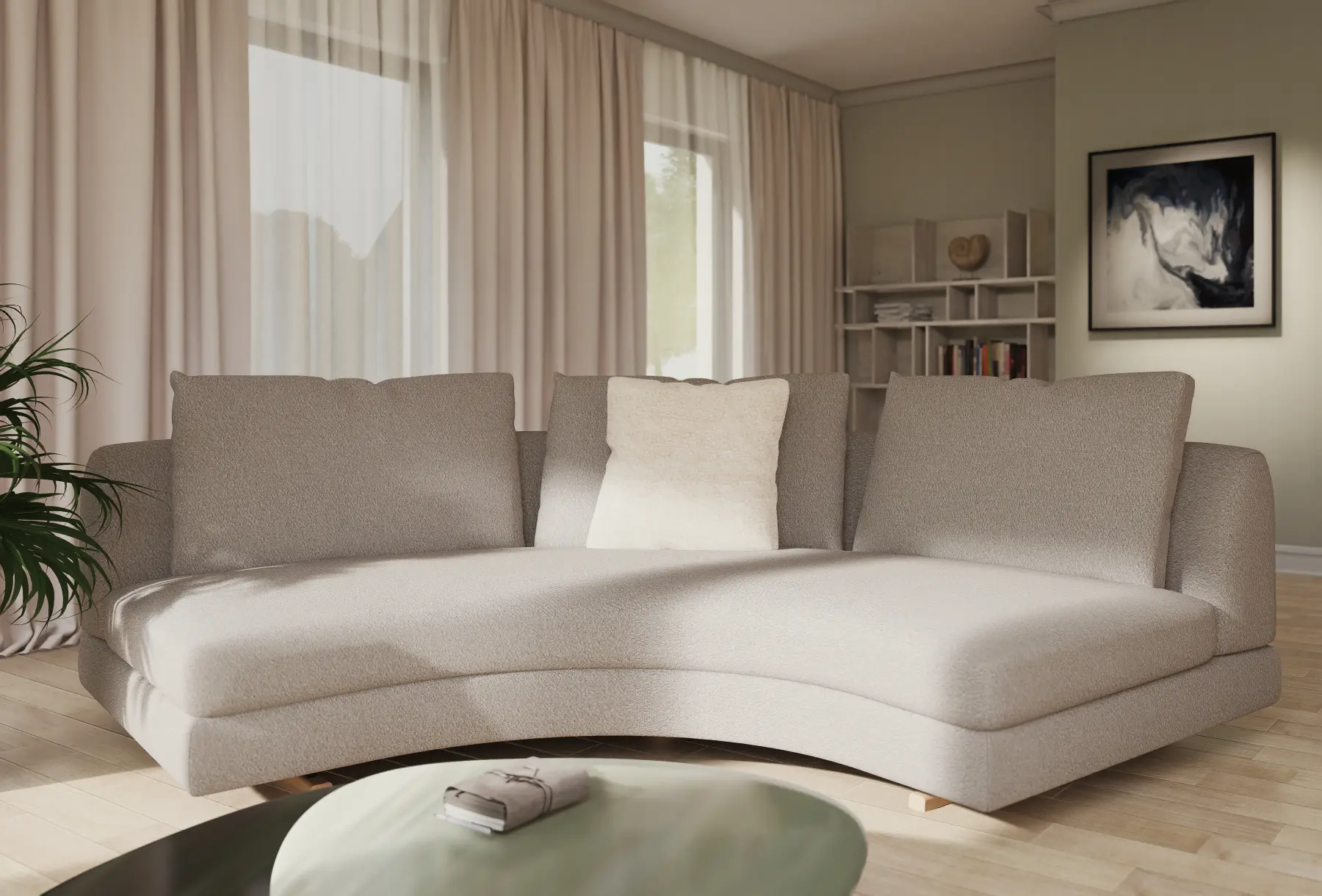 gerundetes Sofa vor salbeifarbiger Wand