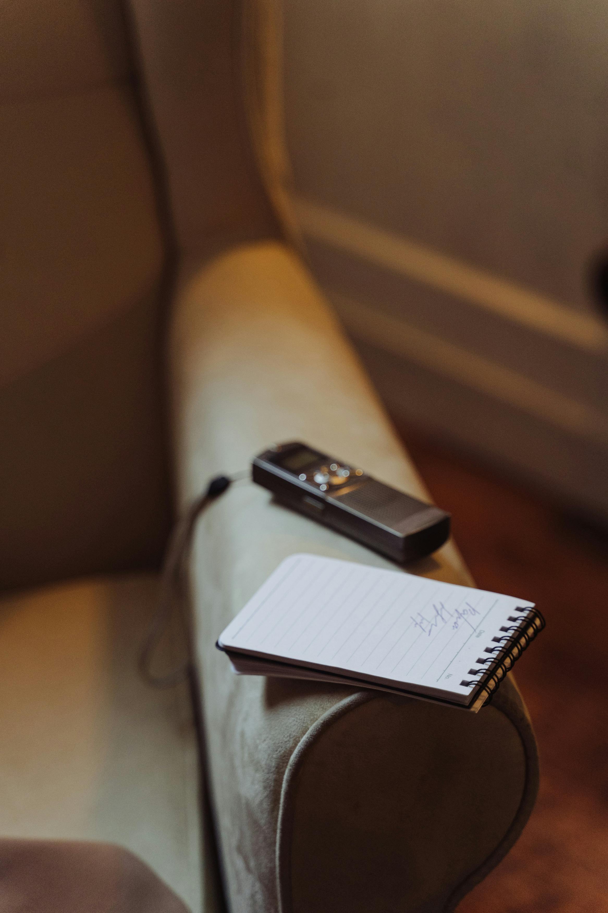 An image of a pad and voice recorder during a user interview | UX Research