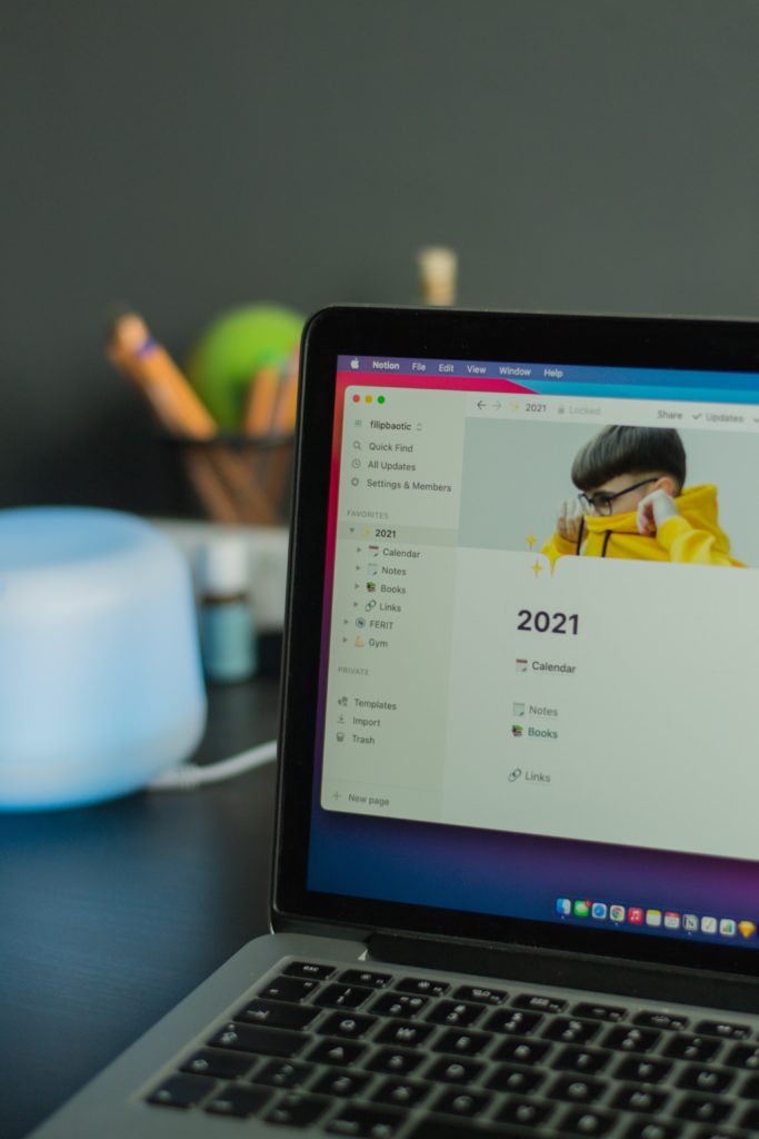 A laptop with a notion page titled 2021