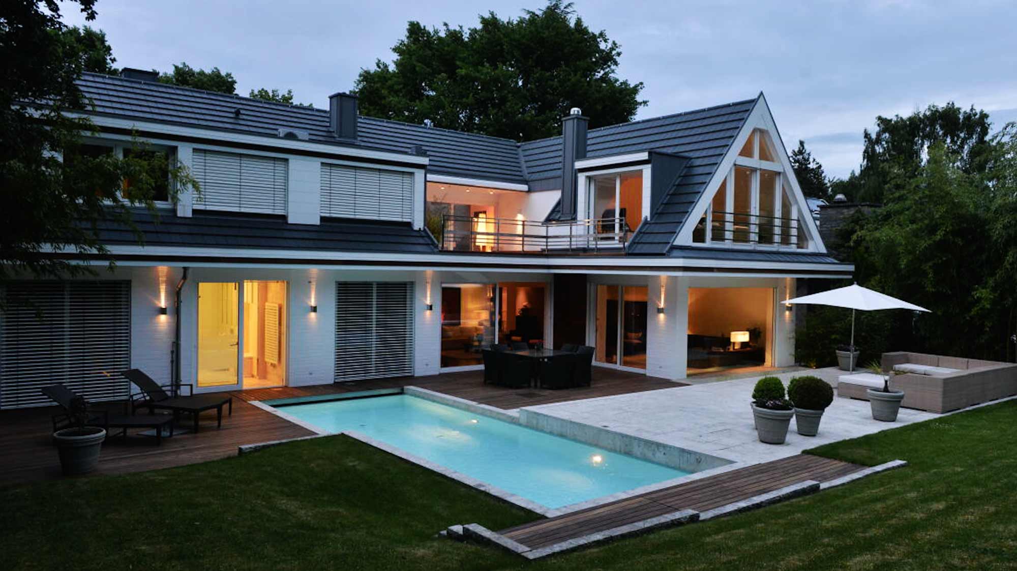 Modern home exterior with pool, perfect setup for strategic filmproduction, advertising, and social media campaign storytelling.