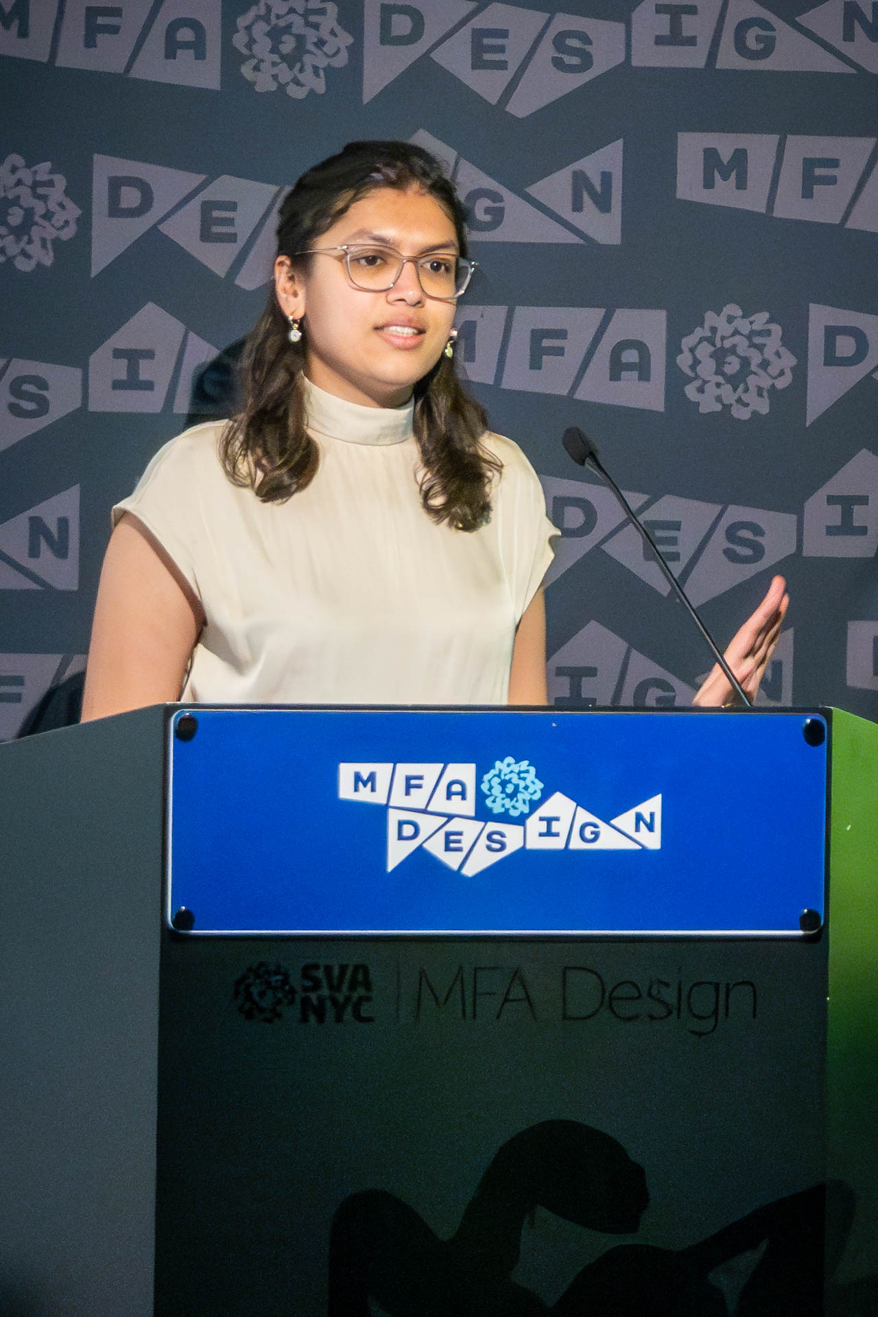 student at a podium giving a presentation