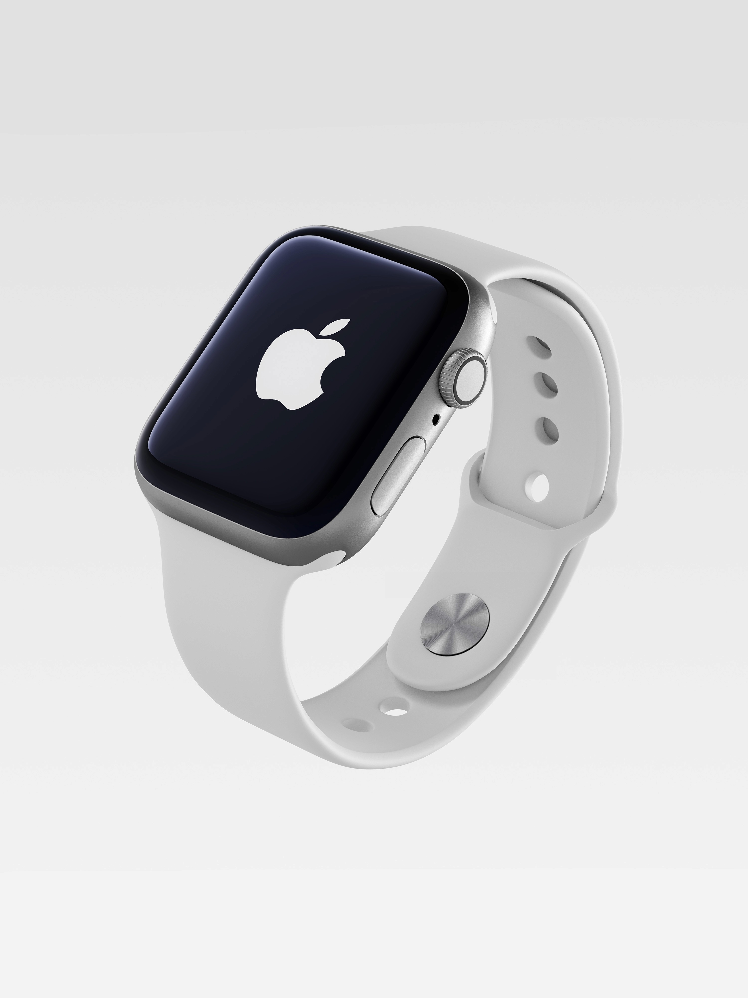 Render 3D di Apple Watch con cassa in alluminio e cinturino sport bianco. Smartwatch fluttuante su sfondo grigio chiaro sfumato con logo Apple sul display.