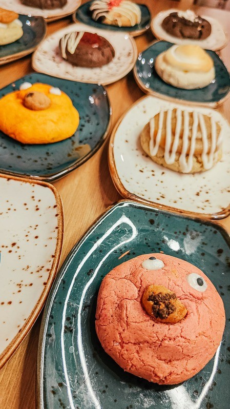 Plate of assorted cookies including monster and apple pie flavors