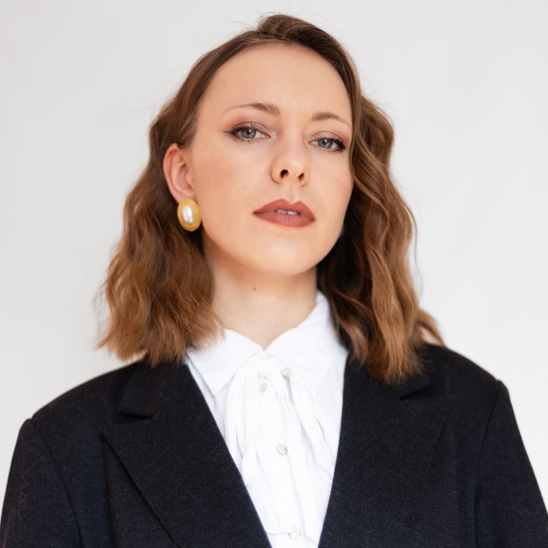 Black and white photo of man posing on camera