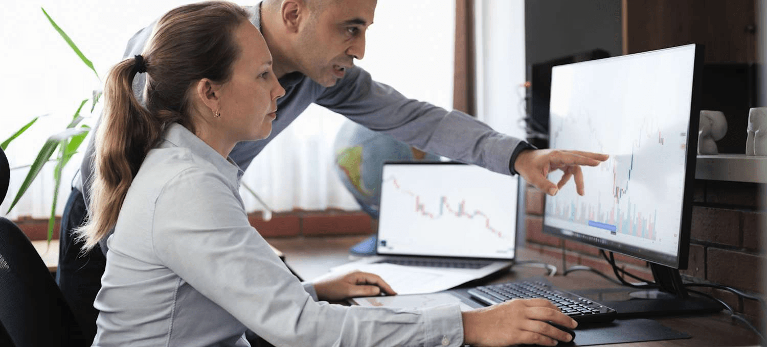 Man pointing at monitor screen - What is Onchain