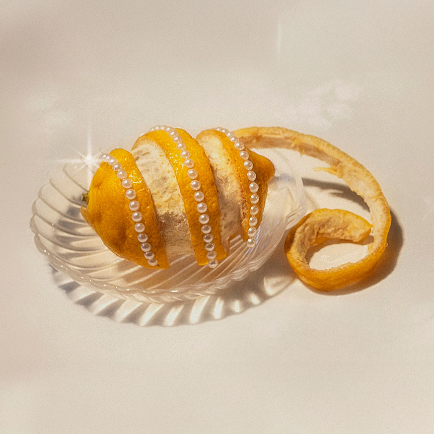 a small animal sitting on top of a large rock