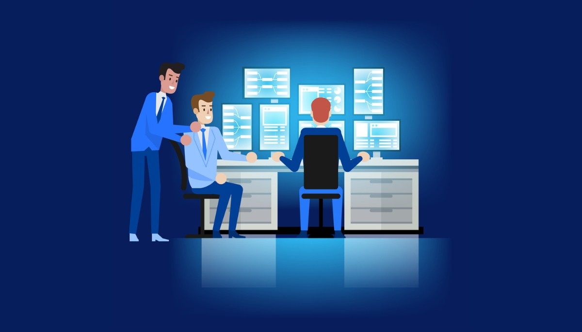 Illustration of three professionals working in a control‑room setting, monitoring multiple screens filled with data charts and system interfaces, with one person standing and guiding the others.