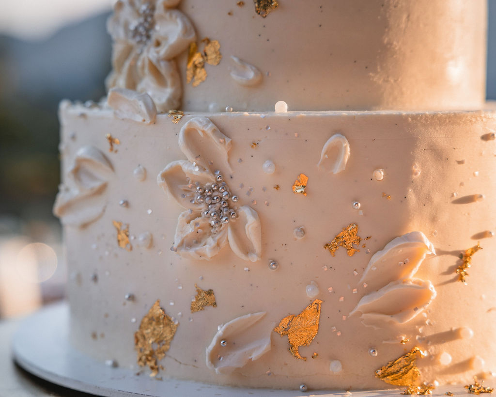 Wedding cake detail with textured frosting at Smith Cabin Aspen wedding reception