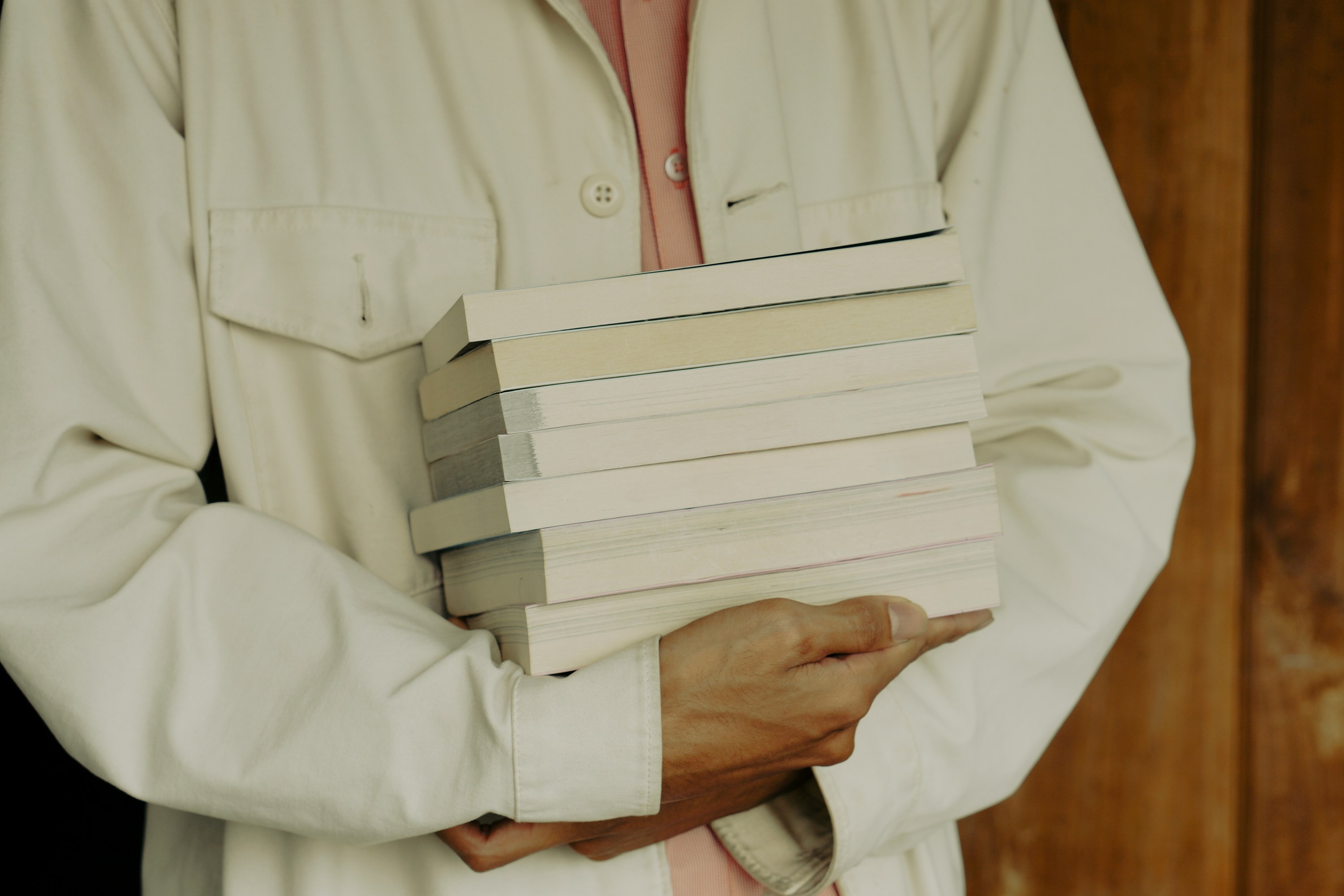 med student holding bunch of books - how difficult is medical school