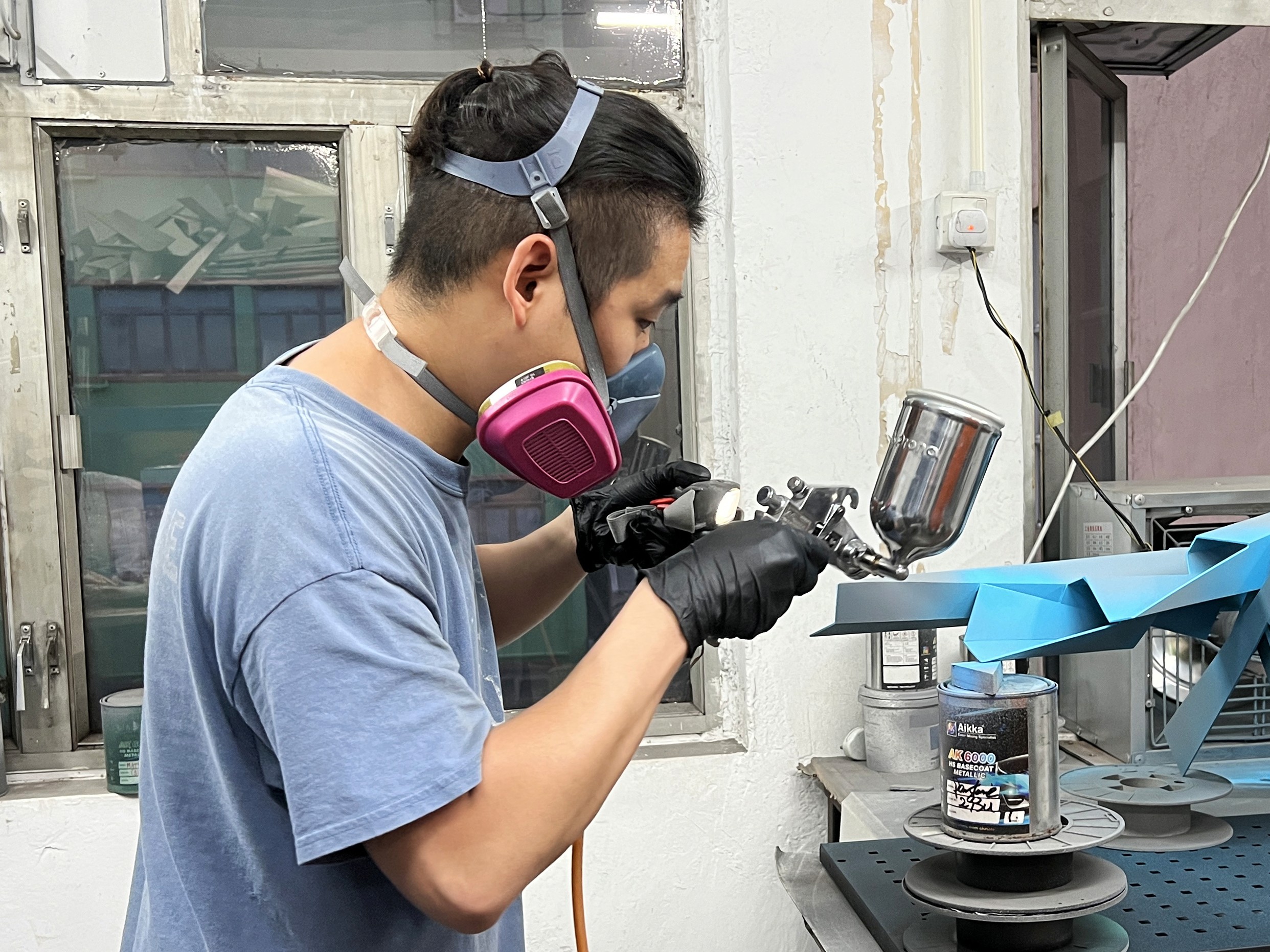 a woman holding a red flower