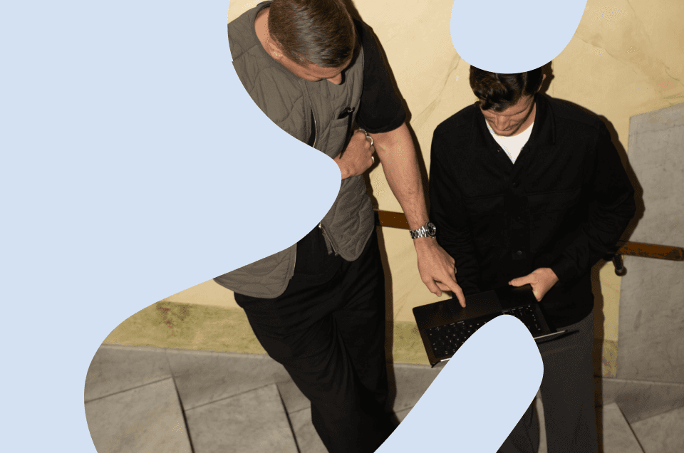 Rows of empty green stadium seats viewed from above, forming a repeating pattern — representing scale, audience reach, and how strong B2B brand impact is built by engaging the right accounts at scale rather than everyone at once.