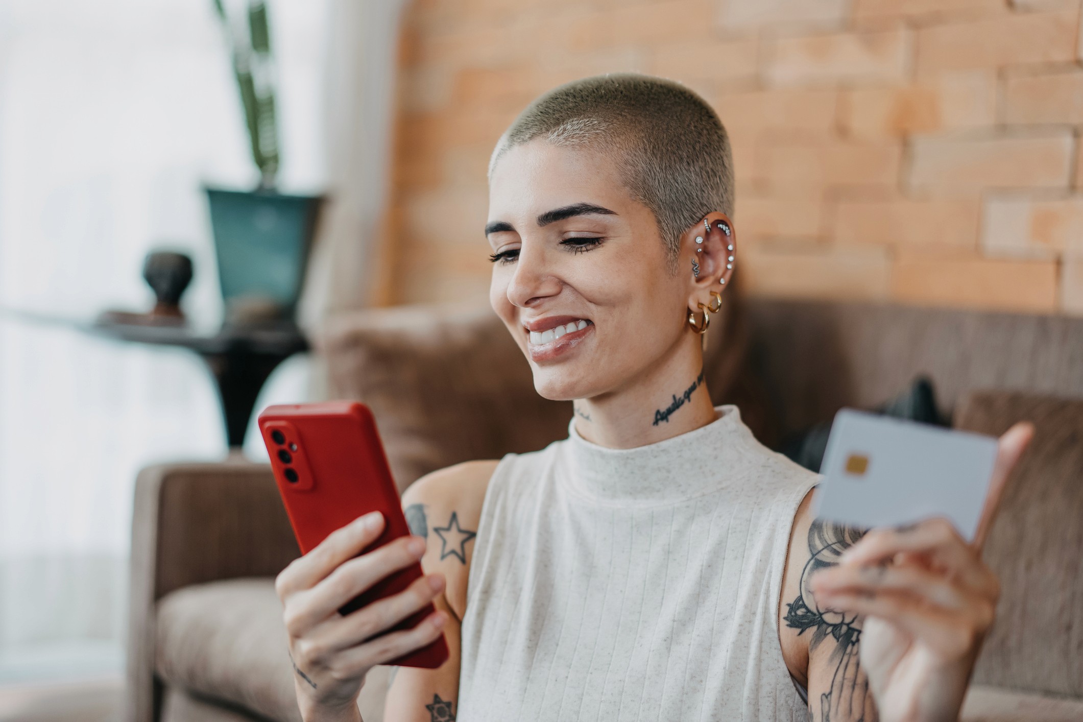 Cool young woman shopping online on her smartphone