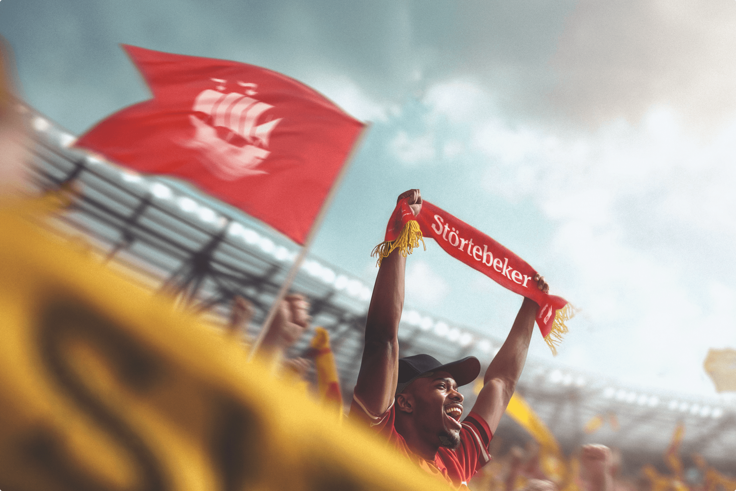 Fan cheering with a Störtebeker scarf and flag