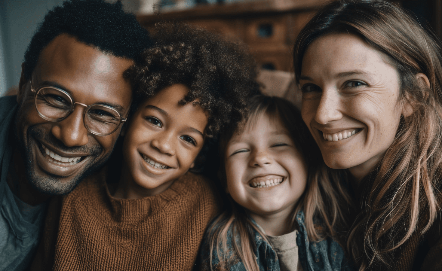 Two men discuss a project while standing at a laptop in an office.